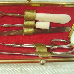 Vintage travel size/purse size manicure set in small gold case